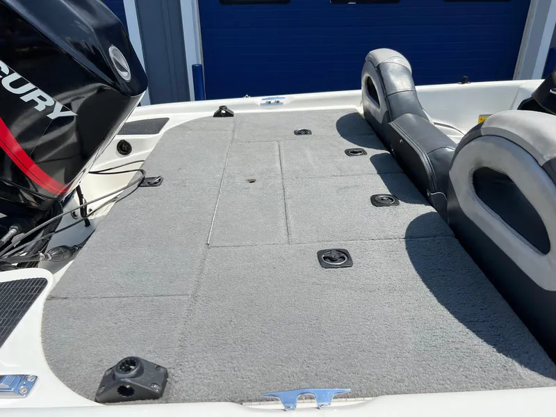 Slide: The Image of 2000 Triton TR170C boat with Mercury engine and spacious deck. - 14