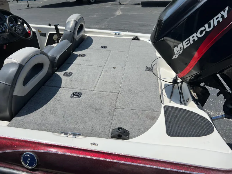 Slide: The Image of 2000 Triton TR170C boat with Mercury outboard motor and spacious deck. - 16