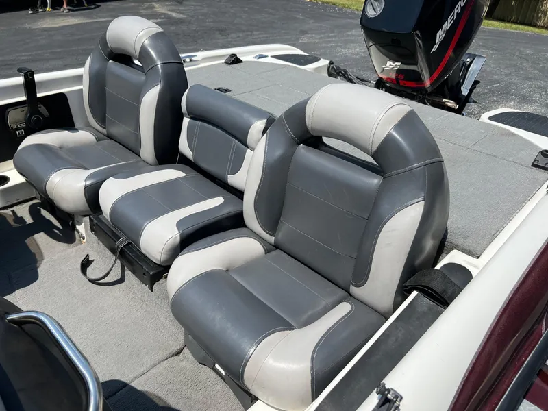 Slide: The Image of 2000 Triton TR170C boat interior with gray and white seating. - 18