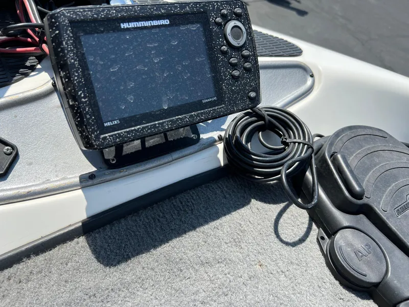 Slide: The Image of Humminbird fish finder and foot pedal on a 2000 Triton TR170C boat. - 20
