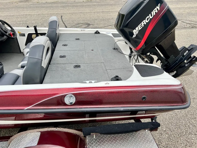 Slide: The Image of 2000 Triton TR170C boat with Mercury outboard motor on trailer. - 4