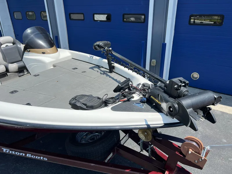 Slide: The Image of 2000 Triton TR170C fishing boat on trailer, equipped with trolling motor. - 9