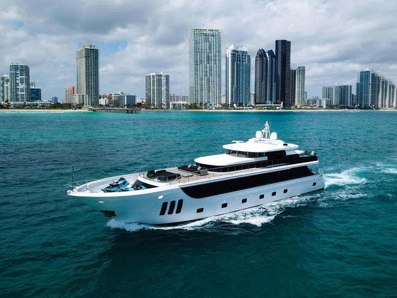 Slide: The Image of Luxurious 2010 Custom WHS Marine yacht cruising near a city skyline. - 2