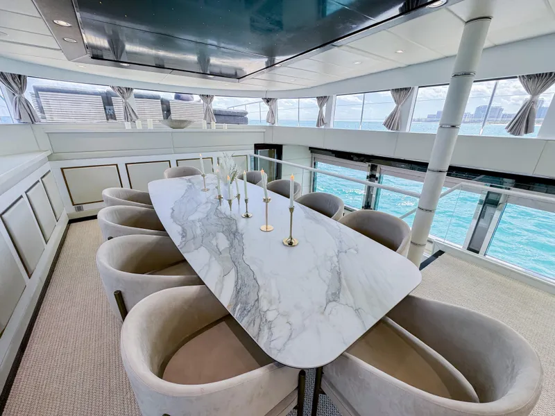 Slide: The Image of Luxurious dining area on a 2010 Custom WHS Marine yacht with ocean views. - 22