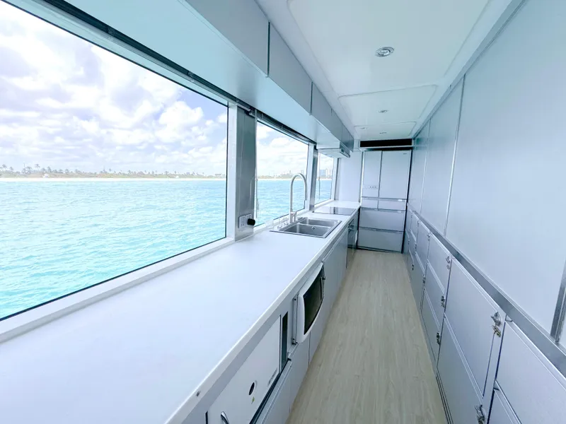 Slide: The Image of Modern kitchen interior on a 2010 Custom WHS Marine boat with ocean view. - 23