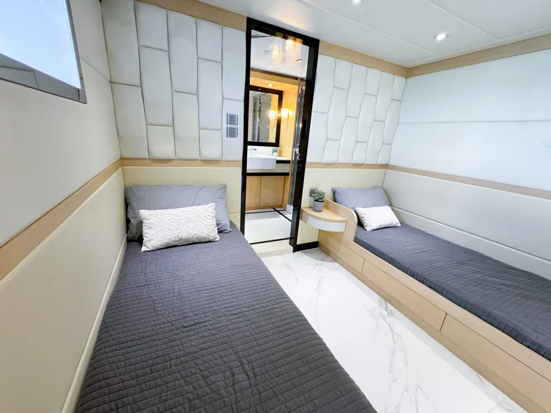 Slide: The Image of Modern twin cabin interior of 2010 Custom WHS Marine yacht with sleek design and comfortable bedding. - 39