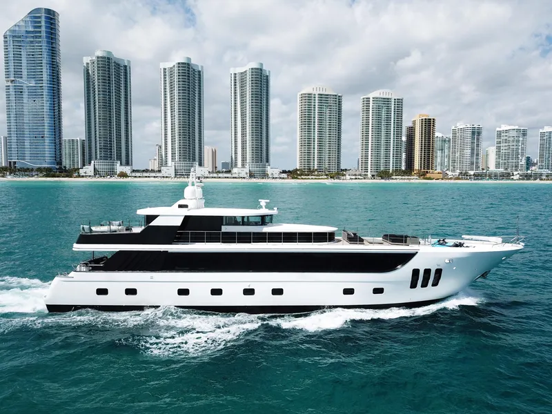 Slide: The Image of Luxurious 2010 Custom WHS Marine yacht cruising near a city skyline. - 4