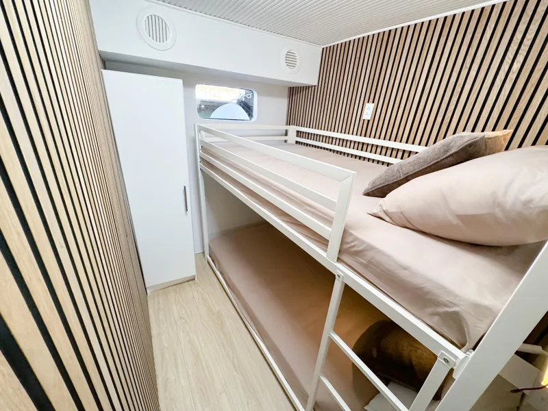 Slide: The Image of Modern bunk bed cabin in 2010 Custom WHS Marine boat with wood paneling. - 47