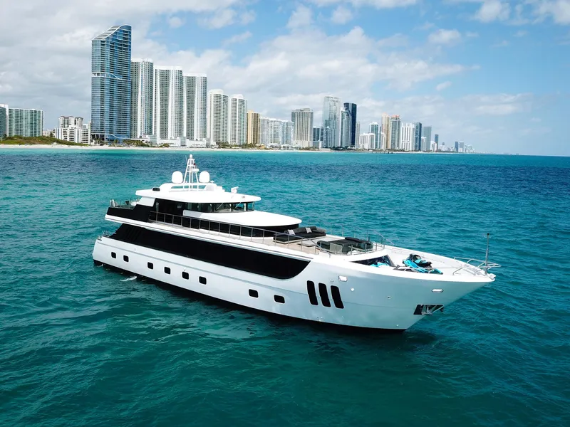 Slide: The Image of Luxury Custom WHS Marine yacht cruising near a city skyline, 2010 model. - 5