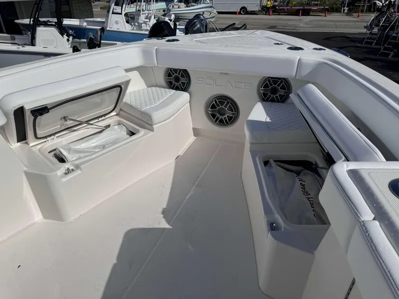Slide: The Image of 2024 Solace 37 CS boat interior with storage compartments and seating. - 15