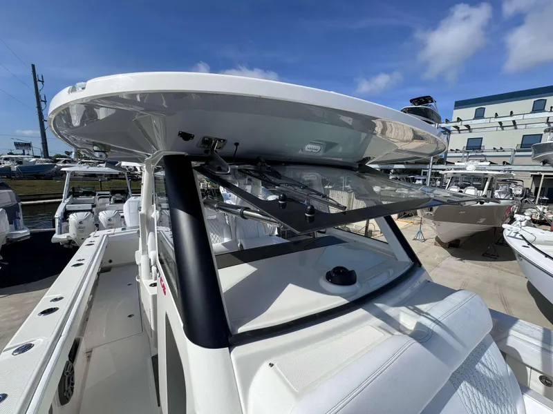 Slide: The Image of 2024 Solace 37 CS boat with advanced helm and seating area. - 18