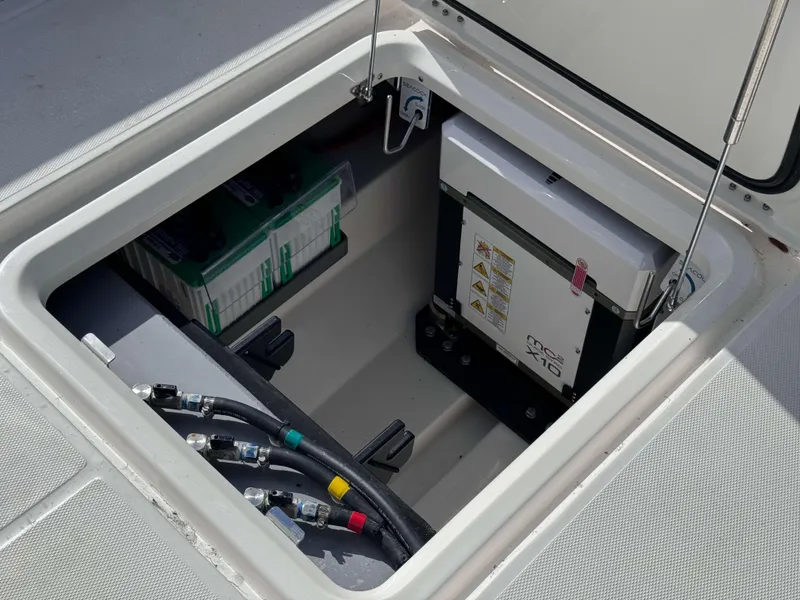 Slide: The Image of 2024 Solace 37 CS boat storage compartment with electrical components and wiring. - 20