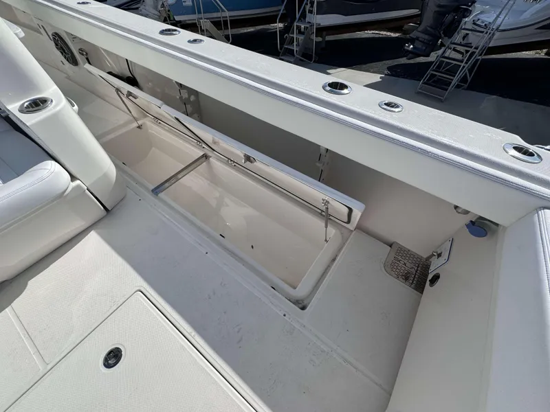 Slide: The Image of 2024 Solace 37 CS boat interior with open storage compartment. - 21