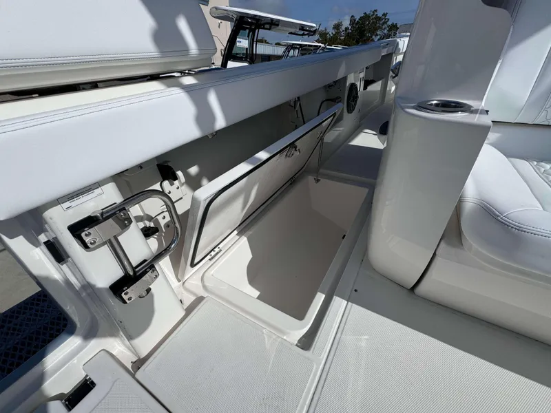 Slide: The Image of Open storage compartment on a 2024 Solace 37 CS boat. - 23