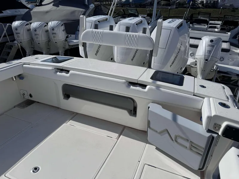 Slide: The Image of 2024 Solace 37 CS boat with multiple outboard engines and spacious deck. - 3