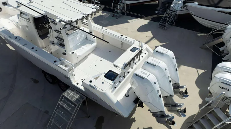 Slide: The Image of 2024 Solace 37 CS boat with triple Yamaha outboard engines. - 34