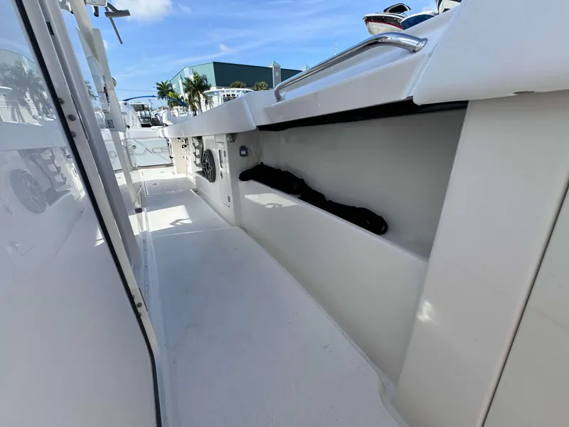 Slide: The Image of 2024 Solace 37 CS boat deck with storage compartments and speakers. - 35