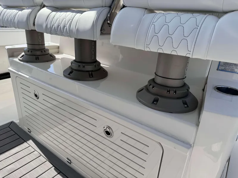 Slide: The Image of 2024 Solace 37 CS boat seating with shock-absorbing pedestals and storage compartment. - 9