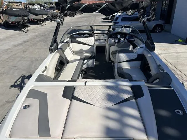 Slide: The Image of 2014 Tigé RZ4 boat interior with seating and dashboard view. - 10