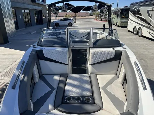 Slide: The Image of 2014 Tigé RZ4 boat interior with stylish seating and cup holders. - 4