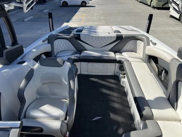 Slide: The Image of 2014 Tigé RZ4 boat interior with spacious seating and modern design. - 9