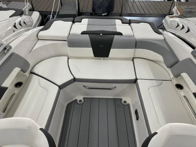 Slide: The Image of 2024 Chaparral 23 SSi OB boat interior with white and gray seating. - 10
