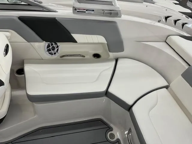 Slide: The Image of Interior seating of 2024 Chaparral 23 SSi OB boat with white and gray upholstery. - 11