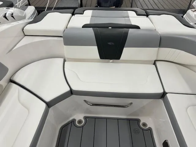 Slide: The Image of 2024 Chaparral 23 SSi OB boat interior seating with white and gray upholstery. - 12