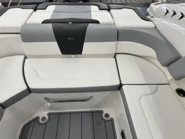Slide: The Image of 2024 Chaparral 23 SSi OB boat interior seating with gray and white upholstery. - 13