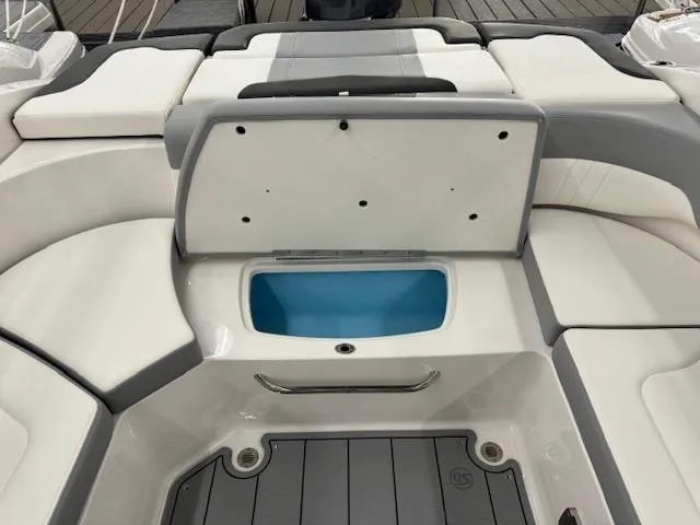 Slide: The Image of 2024 Chaparral 23 SSi OB boat interior with open storage compartment. - 15