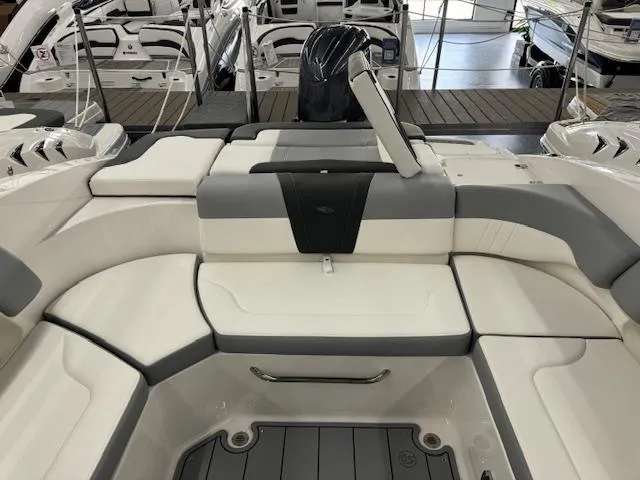 Slide: The Image of 2024 Chaparral 23 SSi OB boat interior with white and gray seating. - 18