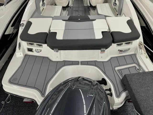 Slide: The Image of 2024 Chaparral 23 SSi OB boat, rear view with seating and outboard motor. - 22