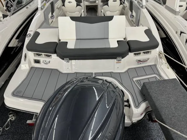 Slide: The Image of 2024 Chaparral 23 SSi OB boat with outboard motor and spacious seating. - 23