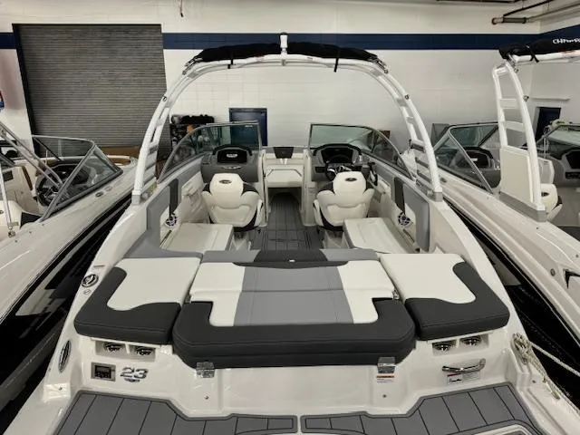 Slide: The Image of 2024 Chaparral 23 SSi OB boat interior with seating and helm. - 3