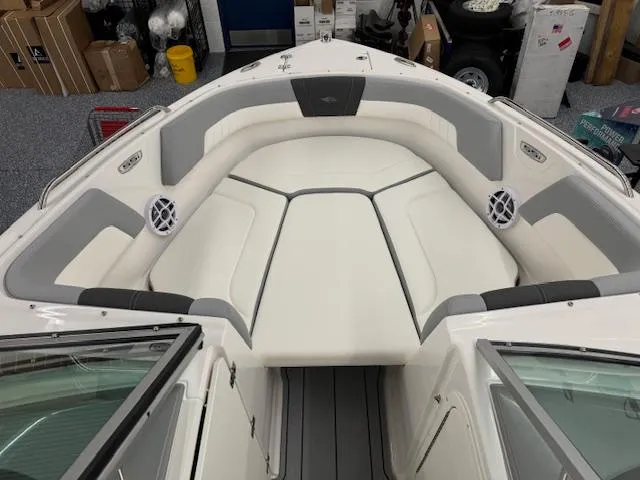 Slide: The Image of 2024 Chaparral 23 SSi OB boat interior with white and gray seating. - 4