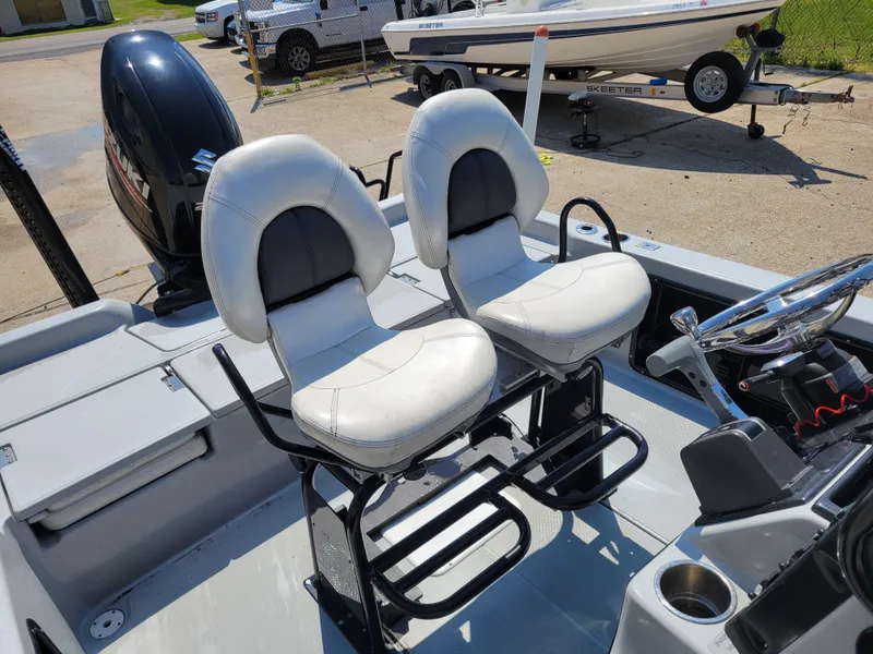 Slide: The Image of 2017 Blue Wave 2200 PureBay boat interior with dual white captain's chairs. - 15