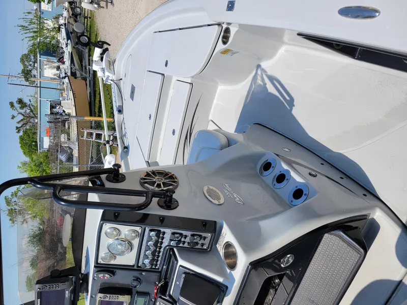 Slide: The Image of 2017 Blue Wave 2200 PureBay boat interior with control panel and seating. - 17