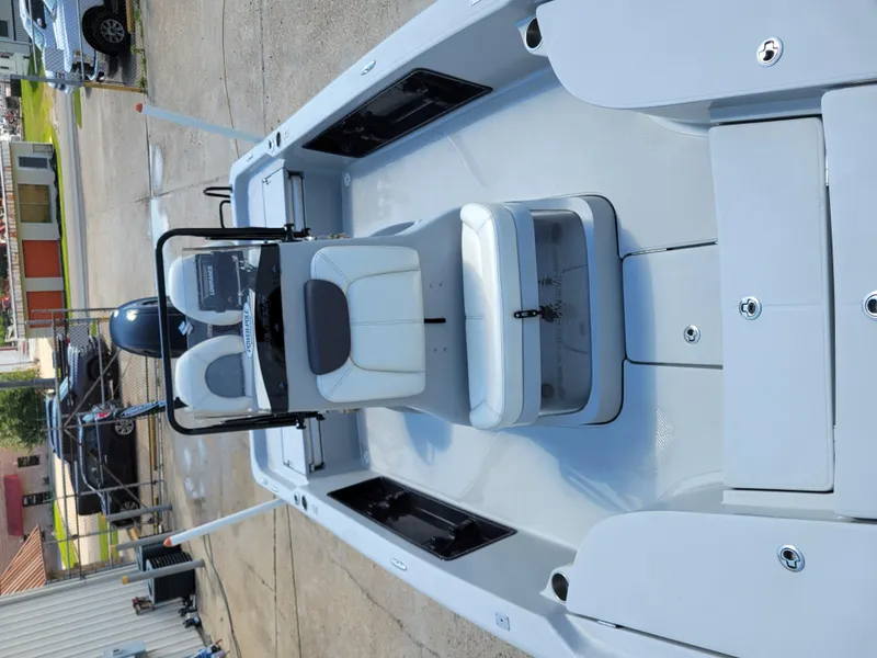 Slide: The Image of 2017 Blue Wave 2200 PureBay boat interior with seating and storage compartments. - 19