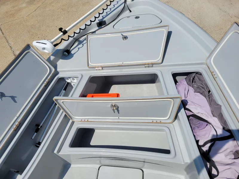 Slide: The Image of 2017 Blue Wave 2200 PureBay boat storage compartments open. - 20
