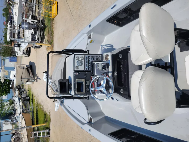Slide: The Image of 2017 Blue Wave 2200 PureBay boat interior with dual seats and control panel. - 22