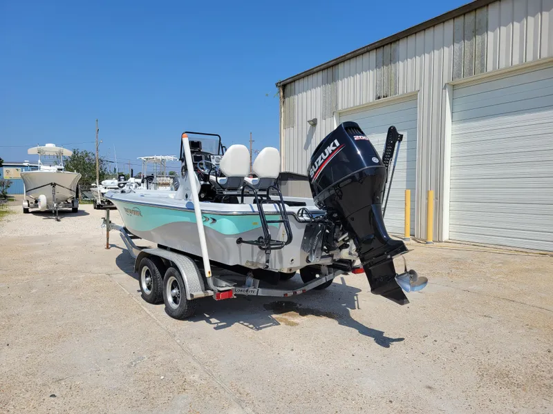 Slide: The Image of 2017 Blue Wave 2200 PureBay boat with Suzuki outboard motor on trailer. - 5