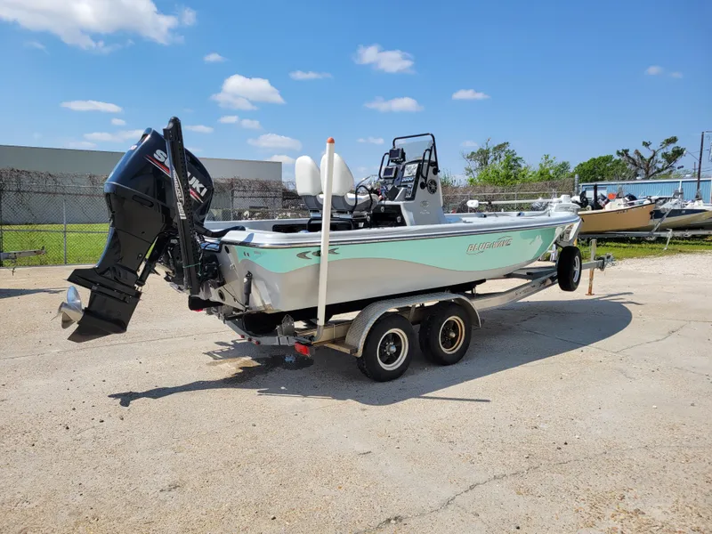 Slide: The Image of 2017 Blue Wave 2200 PureBay boat on a trailer in a parking lot. - 7