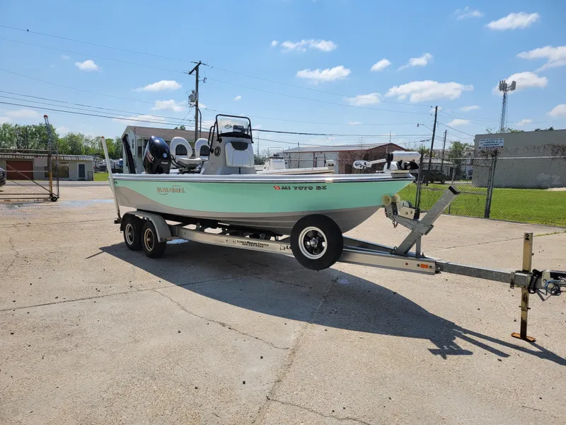 Slide: The Image of 2017 Blue Wave 2200 PureBay boat on a trailer in a parking lot. - 9