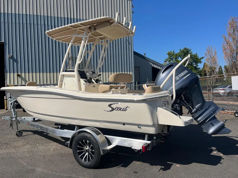 Slide: The Image of 2024 Scout 195 Sportfish boat with Yamaha outboard motor on trailer. - 2