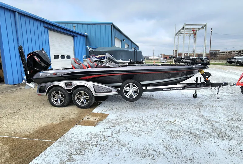 Slide: The Image of 2024 Ranger Z520R Ranger Cup Equipped boat on trailer near blue building. - 1