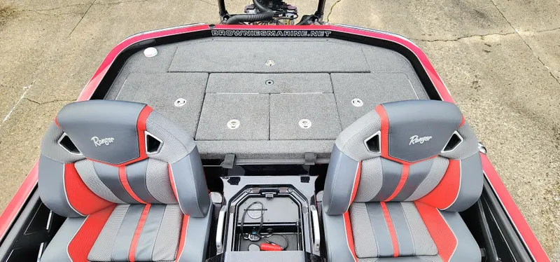 Slide: The Image of 2024 Ranger Z520R boat interior with gray and red seats, spacious deck. - 10