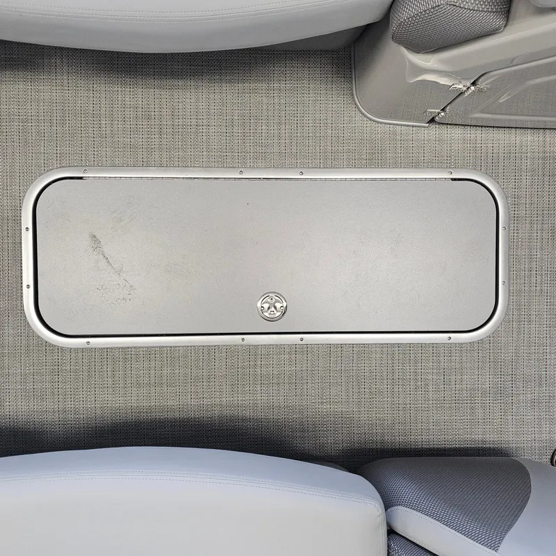 Slide: The Image of 2024 Regency 250 LE3 Sport boat floor storage compartment. - 10