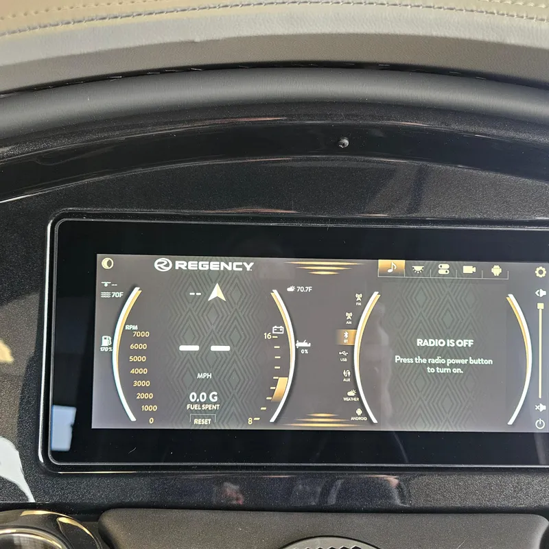 Slide: The Image of 2024 Regency 250 LE3 Sport dashboard display showing speed, RPM, and radio status. - 19