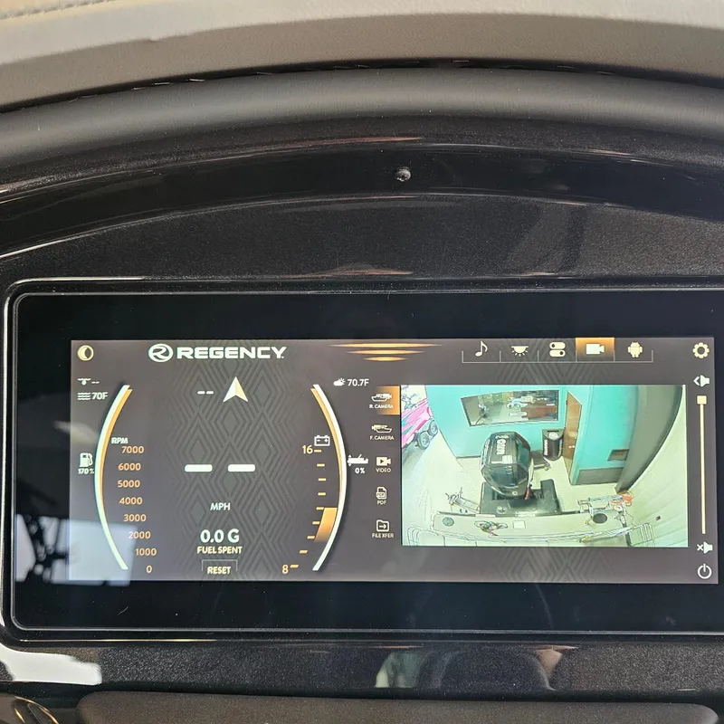 Slide: The Image of 2024 Regency 250 LE3 Sport dashboard display with speedometer and rearview camera. - 20