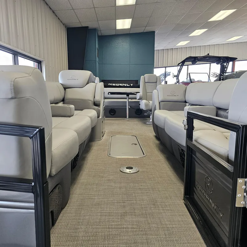 Slide: The Image of 2024 Regency 250 LE3 Sport pontoon boat interior with luxurious seating. - 25